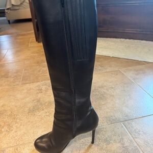 Louboutin knee high letter boots.